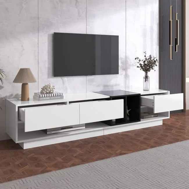 Long white media console with black center cabinet, open niche, and storage drawers