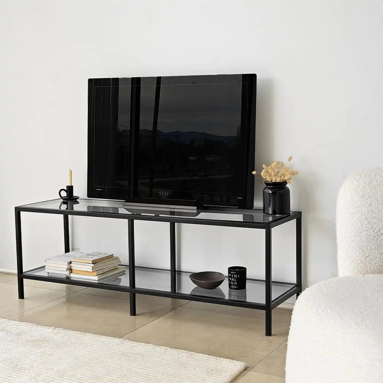 Black TV table, MDF build, two open shelves; 140cm long