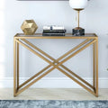 Gold metal console table with glass shelf and X-cross frame